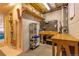 Utility basement featuring a workbench, shelving, and organized storage solutions, providing ample space at 10735 W Dartmouth Ave, Lakewood, CO 80227