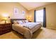 Comfortable bedroom featuring neutral tones, ample natural light, and a cozy atmosphere at 10735 W Dartmouth Ave, Lakewood, CO 80227