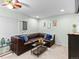 Basement with a large brown leather sectional, carpet flooring and recessed lighting at 12089 W Chenango Dr, Morrison, CO 80465