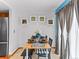 Charming dining room featuring modern lighting, neutral decor, and ample natural light at 12089 W Chenango Dr, Morrison, CO 80465