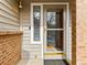 Inviting front door with glass, sidelight window, and secure Ring doorbell system at 12089 W Chenango Dr, Morrison, CO 80465