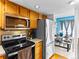 Modern kitchen with stainless steel appliances and classic wood cabinets at 12089 W Chenango Dr, Morrison, CO 80465