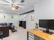 Open concept living room area with modern design, comfortable seating and an entertainment center at 12089 W Chenango Dr, Morrison, CO 80465