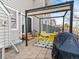 A well-appointed patio with a pergola, dining set, and a barbecue grill at 12089 W Chenango Dr, Morrison, CO 80465