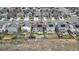 A neighborhood aerial view shows the roof tops and streetscape of similar homes in a suburban community at 432 N Patsburg St, Aurora, CO 80018
