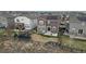 An aerial view of a backyard with a small fence shows a trampoline and patio with seating at 432 N Patsburg St, Aurora, CO 80018