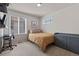 Simple bedroom with a neutral palette and functional desk and storage spaces at 432 N Patsburg St, Aurora, CO 80018