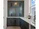 Pantry view with modern cabinets, sleek hardware, and quartz countertops, offering ample storage at 432 N Patsburg St, Aurora, CO 80018