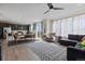 Spacious living room with hardwood flooring, modern décor, and ample natural light at 432 N Patsburg St, Aurora, CO 80018