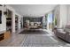 Open layout with hardwood flooring, kitchen view, and great flow for entertaining at 432 N Patsburg St, Aurora, CO 80018