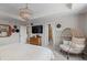 Tranquil primary bedroom featuring tray ceilings, a chandelier, and a decorative sitting chair at 432 N Patsburg St, Aurora, CO 80018