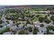 Stunning aerial view showcasing Plum Creek Golf Club, its surrounding neighborhood, and serene landscaping at 185 Players Club Dr, Castle Rock, CO 80104