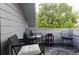 Balcony with chairs and table, offering a cozy outdoor space for relaxing and enjoying the surroundings at 185 Players Club Dr, Castle Rock, CO 80104