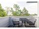 Outdoor balcony area with metal table and chairs, offering a relaxing space with scenic views at 185 Players Club Dr, Castle Rock, CO 80104