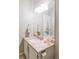 Bathroom featuring a granite countertop vanity, a large mirror, and neutral wall colors at 185 Players Club Dr, Castle Rock, CO 80104