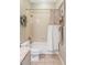 Bathroom with a shower-tub combination, buttoned shower curtain, and a vanity with granite countertop at 185 Players Club Dr, Castle Rock, CO 80104
