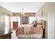 Comfortable bedroom with a floral-patterned bed, dresser, and natural light at 185 Players Club Dr, Castle Rock, CO 80104