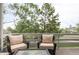 Relaxing outdoor deck area with comfortable seating and views of the trees at 185 Players Club Dr, Castle Rock, CO 80104