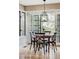 Bright dining room featuring a wooden table and decorative light fixture at 185 Players Club Dr, Castle Rock, CO 80104