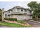 Charming home features a stone accents, two-car garage, and manicured landscaping at 185 Players Club Dr, Castle Rock, CO 80104