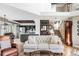 Open-concept living space with hardwood floors and a view of the kitchen and staircase at 185 Players Club Dr, Castle Rock, CO 80104