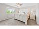Bright bedroom boasts a ceiling fan, natural light, and a window with neighborhood views at 11684 Park South Loop, Parker, CO 80138