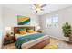 Bright bedroom with a modern ceiling fan, stylish decor and view of the neighborhood at 11684 Park South Loop, Parker, CO 80138