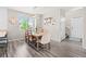 Cozy dining room featuring a wooden table with seating, a window, and stylish decor at 11684 Park South Loop, Parker, CO 80138