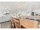 Charming dining area with a wooden table, seating for six, and an open view to living areas at 11684 Park South Loop, Parker, CO 80138