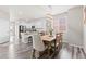Inviting dining area with a wooden table, seating for six, and an open view to the kitchen at 11684 Park South Loop, Parker, CO 80138