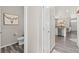 Hallway view leading to the kitchen, showcasing the floor and decor at 11684 Park South Loop, Parker, CO 80138