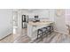 Stylish kitchen with a breakfast bar, stainless steel appliances, and white cabinetry at 11684 Park South Loop, Parker, CO 80138