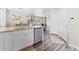 Open-concept kitchen with stainless steel appliances and view into the living room at 11684 Park South Loop, Parker, CO 80138