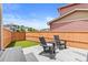 Private backyard with a patio, artificial turf, and lounge seating, perfect for outdoor relaxation at 11684 Park South Loop, Parker, CO 80138
