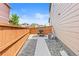 Inviting outdoor area with a paved patio, gravel accents, and wooden fence for privacy at 11684 Park South Loop, Parker, CO 80138