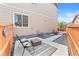 Secluded backyard space featuring a concrete patio area with outdoor seating and gravel landscaping at 11684 Park South Loop, Parker, CO 80138