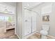 Modern bathroom featuring a tiled shower, tile floors, and decor accents at 11684 Park South Loop, Parker, CO 80138