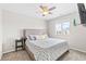 Cozy bedroom with a window, ceiling fan, and comfortable carpeting at 11684 Park South Loop, Parker, CO 80138
