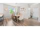Cozy dining area with a large window, rustic wooden table, and stylish decor at 11684 Park South Loop, Parker, CO 80138