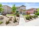 Charming two-story home with a well-maintained lawn, walkway, and beautifully landscaped front yard at 11684 Park South Loop, Parker, CO 80138