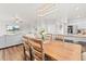 Open floor plan showcasing the dining area and living room with modern decor and ample natural light at 11684 Park South Loop, Parker, CO 80138
