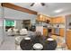 Open-concept dining area seamlessly connected to the kitchen and living room at 3335 S Ammons St # 6-105, Lakewood, CO 80227