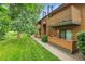 Multi-Gathering building featuring lawns, landscaping, and patios in a courtyard setting at 3335 S Ammons St # 6-105, Lakewood, CO 80227