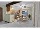 Open kitchen with stainless steel appliances and eat-in dining area at 3335 S Ammons St # 6-105, Lakewood, CO 80227