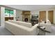 Comfortable living room with stone fireplace and ample natural light at 3335 S Ammons St # 6-105, Lakewood, CO 80227