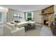 Inviting living room with a stone fireplace and plush seating at 3335 S Ammons St # 6-105, Lakewood, CO 80227