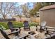 Backyard fire pit area with chairs and a fenced in backyard, perfect for entertaining at 7039 Otis Ct, Arvada, CO 80003