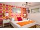 Fun bedroom with retro wall coverings, modern lamp, and natural light at 7039 Otis Ct, Arvada, CO 80003