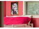 Close-up of bunk bed with pink bedding and window light in a vibrant room at 7039 Otis Ct, Arvada, CO 80003