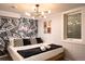 Bedroom with playful rock and roll theme and black and white accents at 7039 Otis Ct, Arvada, CO 80003